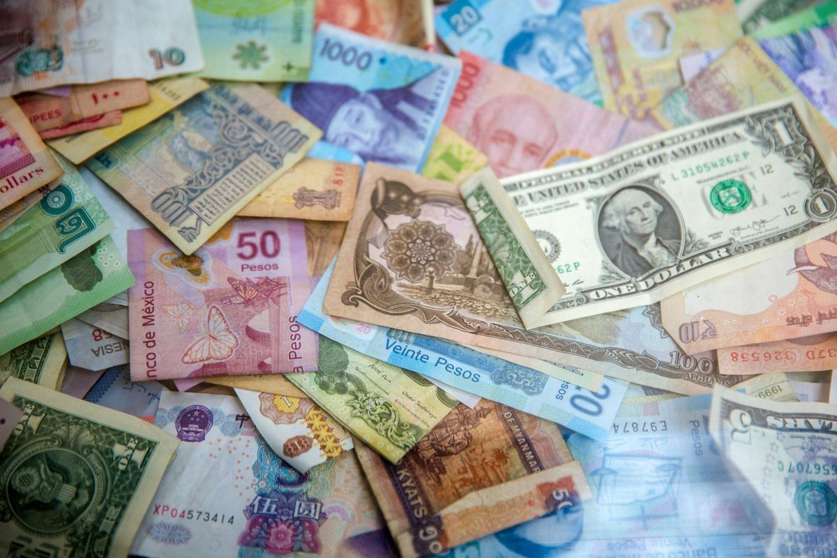 Banknotes of many countries laid out on a table
